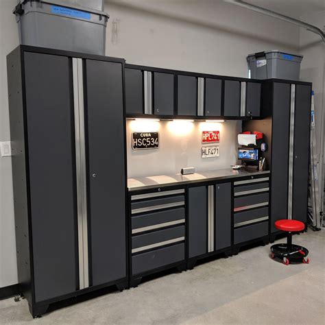 Newage cabinets garage - BEST FOR TOOLS: Fedmax Storage Cabinets with Doors and Shelves. BEST OVERHEAD CABINET: FLEXIMOUNTS 4 x 8 Overhead Garage Storage Rack. BEST TALL CABINET: Rubbermaid 72-Inch Four-Shelf Double-Door ...
